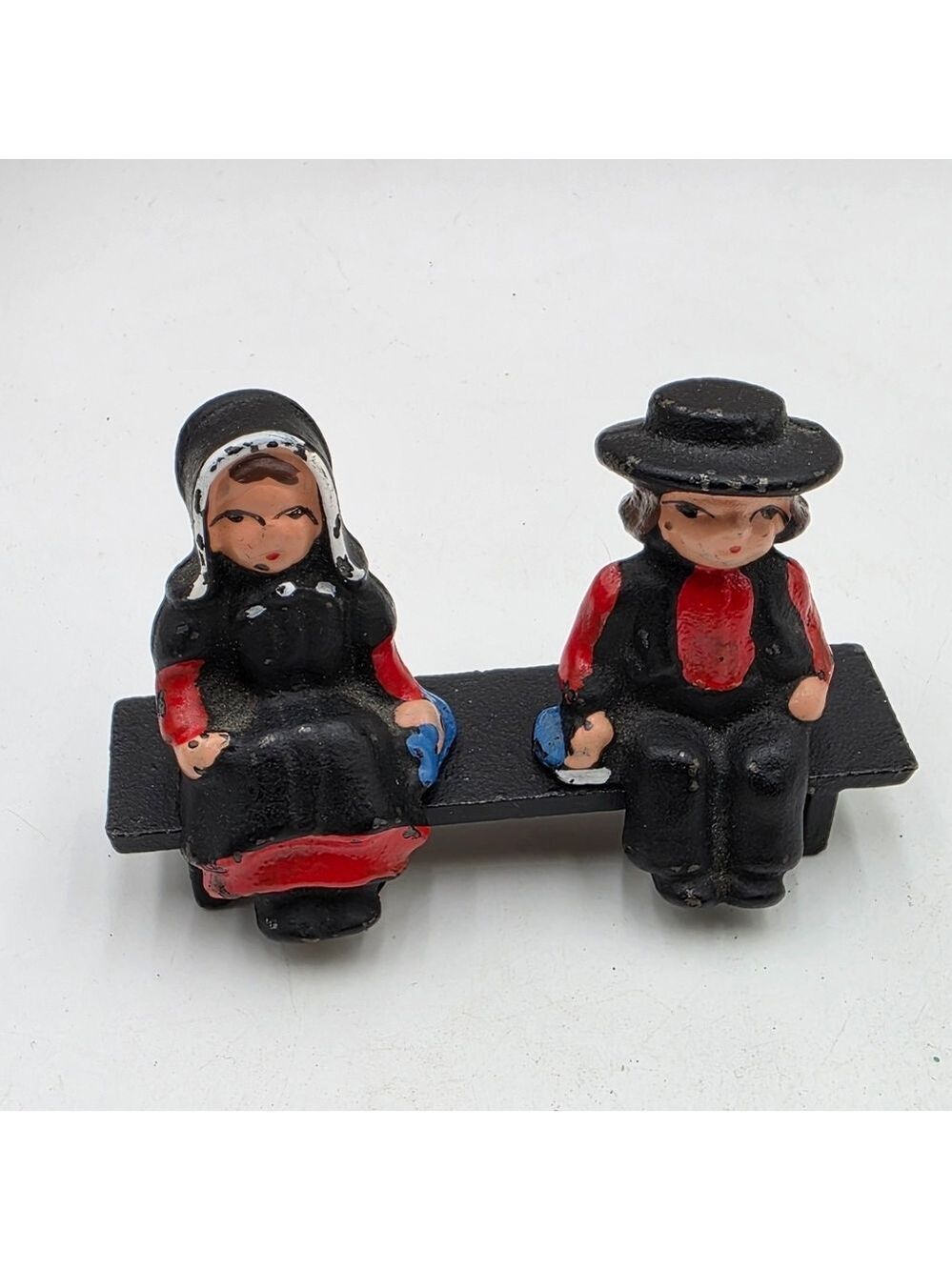 Vintage Cast Iron Painted Amish Man Woman On Bench